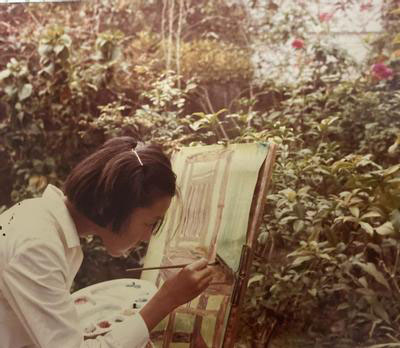 Young Jo painting in her backyard.